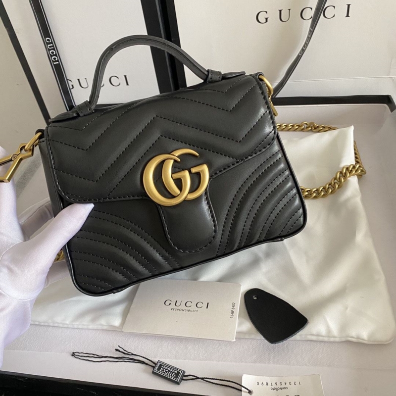 G*u*i top handle bags